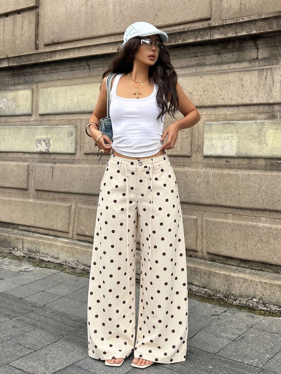Women's casual straight leg striped woven pants featuring a low waist and zipper fly closure.