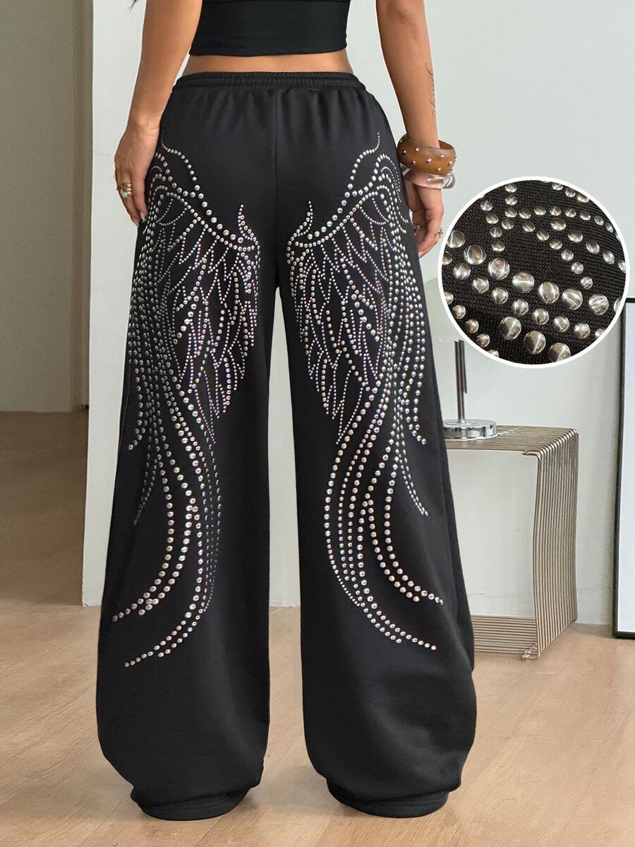 Women's loose fit wide leg graphic sweatpants in light grey with an elastic drawstring waistband