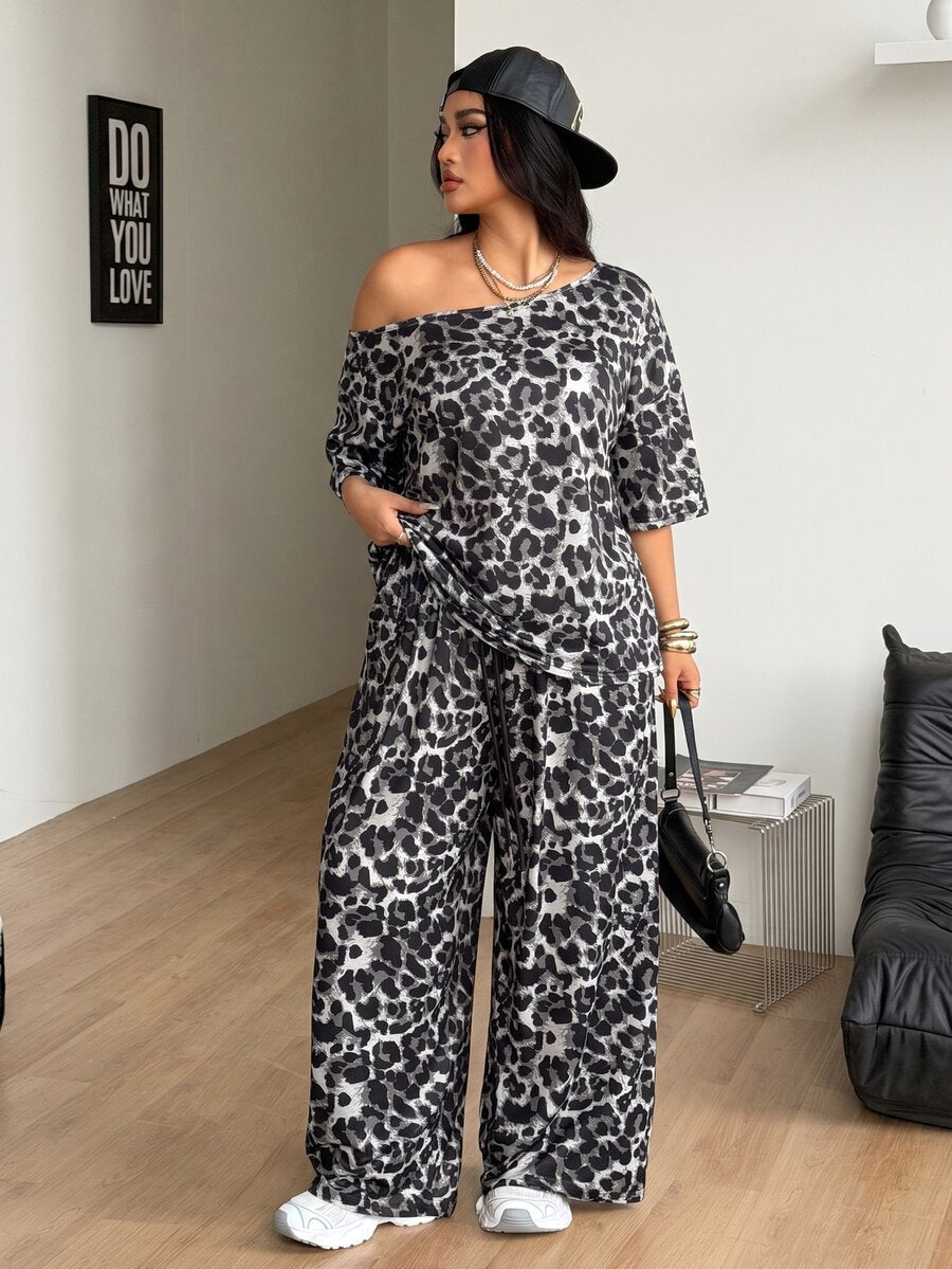 Women's two-piece lounge set featuring a loose drop shoulder asymmetrical neck short sleeve t-shirt and wide-leg knit pants with pockets.