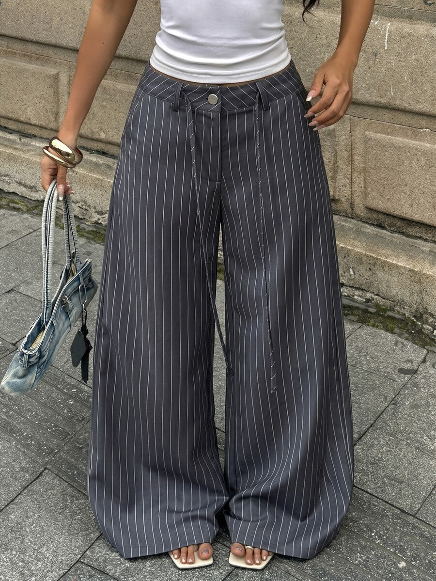 Women's casual straight leg striped woven pants featuring a low waist and zipper fly closure.