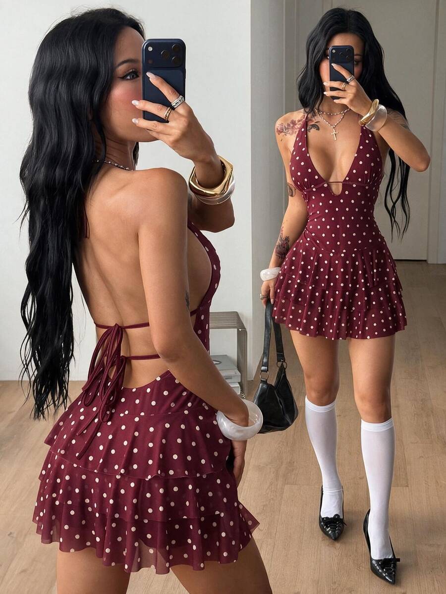 Front view of a women's lace halter mini dress featuring a slim-fit bodice, flared hem, and sleeveless design.
