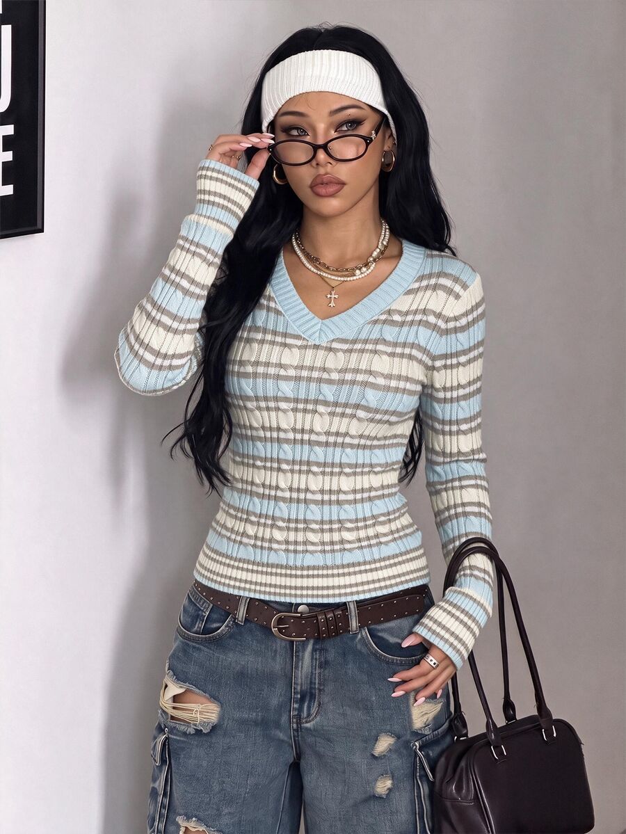 Women's slim fit cable-knit sweater with a V-neckline and long sleeves in solid green rib knit fabric.