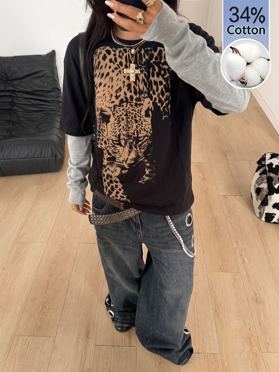 Women's casual graphic long sleeve t-shirt with a round neck, drop shoulder sleeves, and loose relaxed fit.