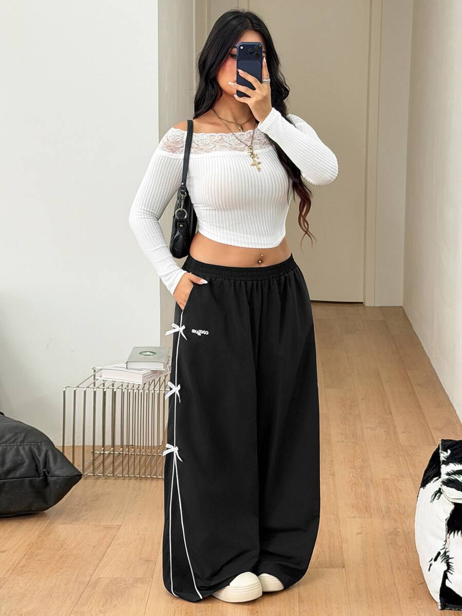 Plus size loose straight leg casual pants with elastic drawstring waist, contrast binding, and side pockets.