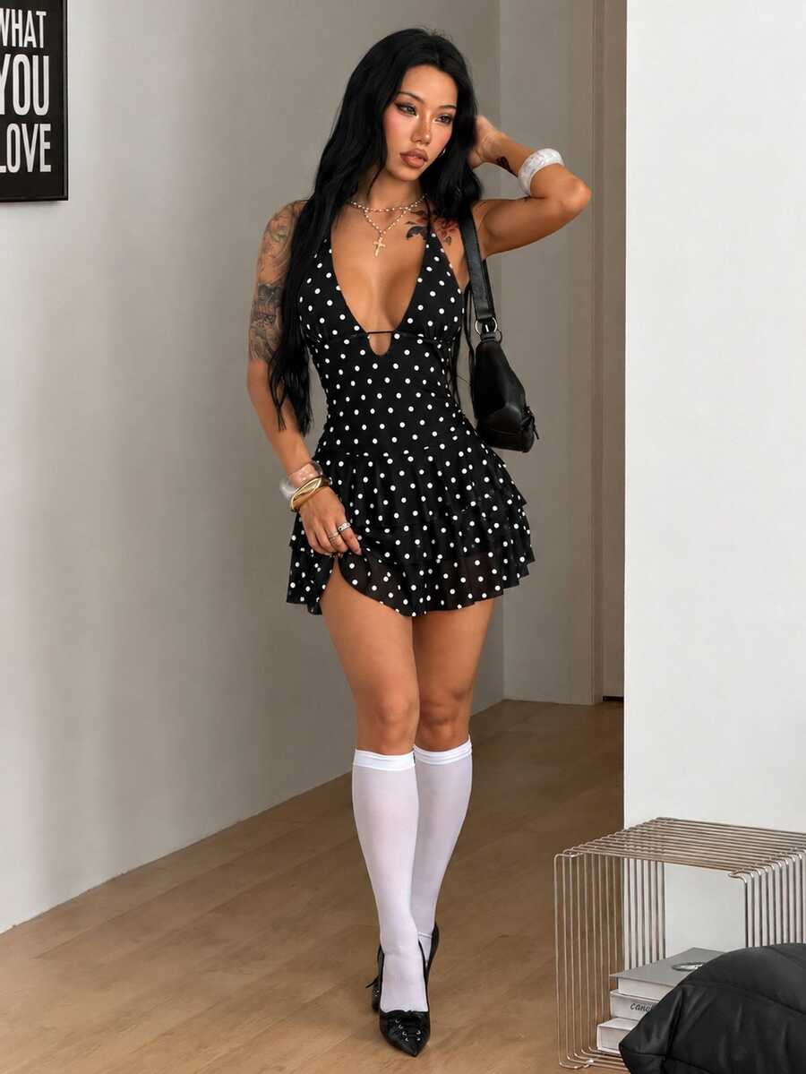 Front view of a women's lace halter mini dress featuring a slim-fit bodice, flared hem, and sleeveless design.