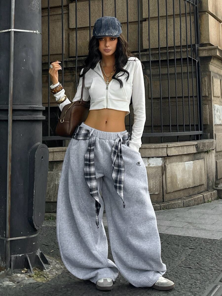 Women's casual grey plaid sweatpants featuring an elastic drawstring waistband, side pockets, and a relaxed loose fit.
