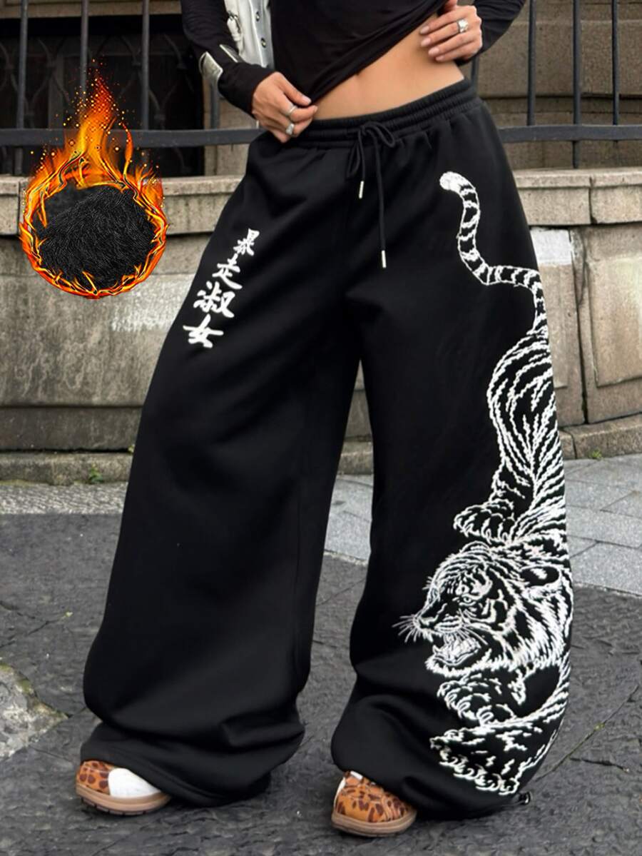 Women's loose fit wide leg graphic sweatpants in light grey with an elastic drawstring waistband