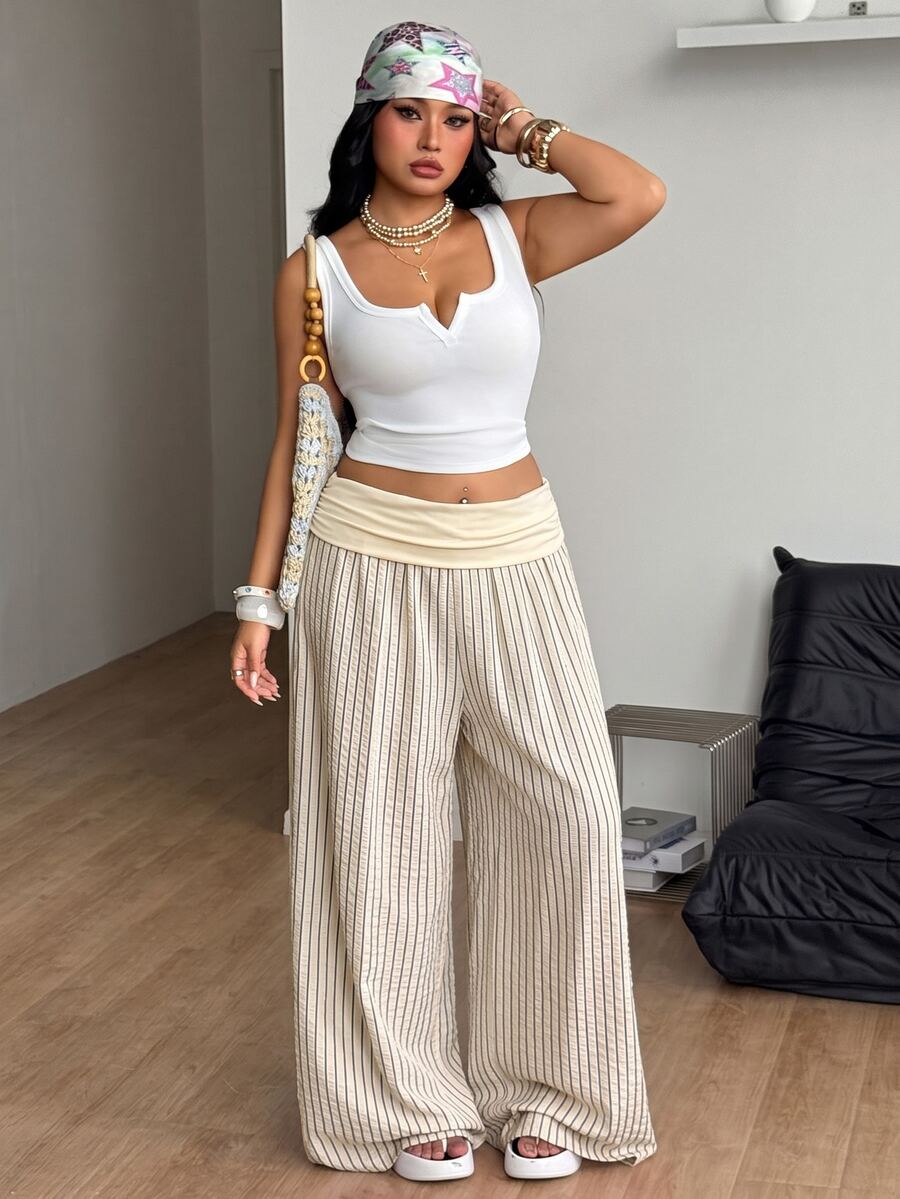 Women's plus size wide leg cotton pants featuring a relaxed loose fit and high waist design.
