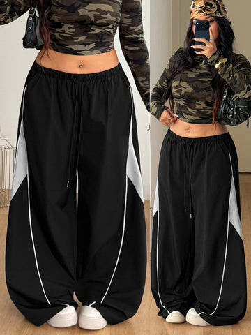 Plus size loose straight leg casual pants with elastic drawstring waist, contrast binding, and side pockets.