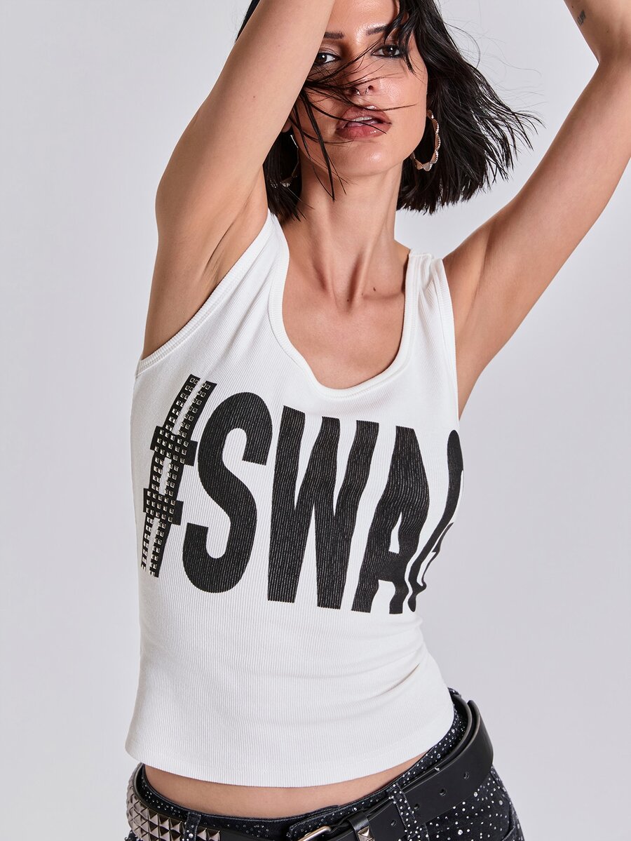 Women's slim fit ribbed scoop neck tank top featuring graphic print and rivet embellishments