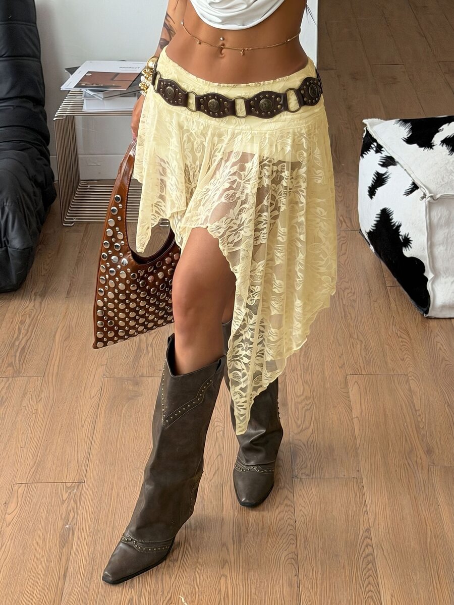 Women's floral lace mini skirt in white with asymmetrical ruffle trim and low waist design.