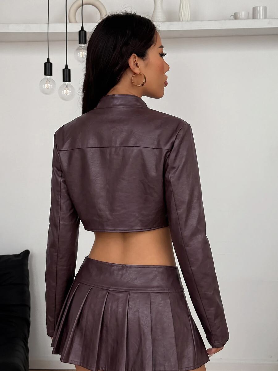 Women's khaki cropped military jacket featuring decorative Napoleon trim, long regular sleeves, tie neck, grommet eyelets, and single-breasted front closure.