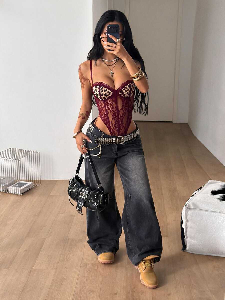 Fitted women's lace and mesh cami bodysuit with spaghetti straps.