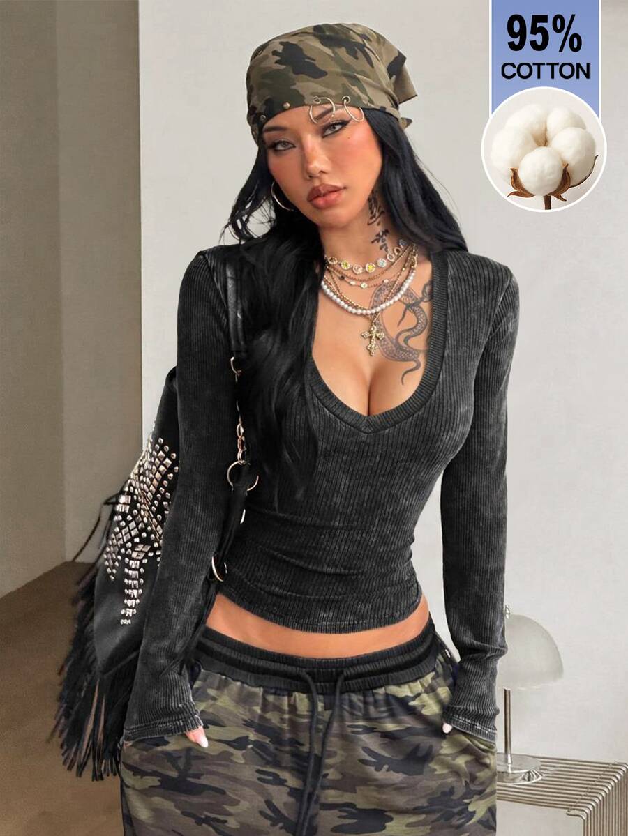 Women's fitted long sleeve rib-knit top featuring a deep V-neckline with delicate contrast lace detailing.