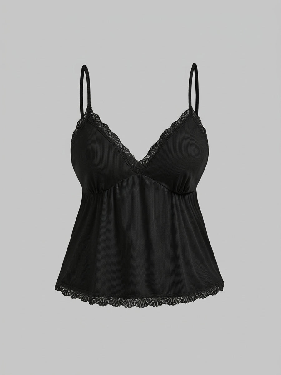 Two-piece ribbed pajama set featuring a lace-trimmed crop camisole top with spaghetti straps and matching shorts.