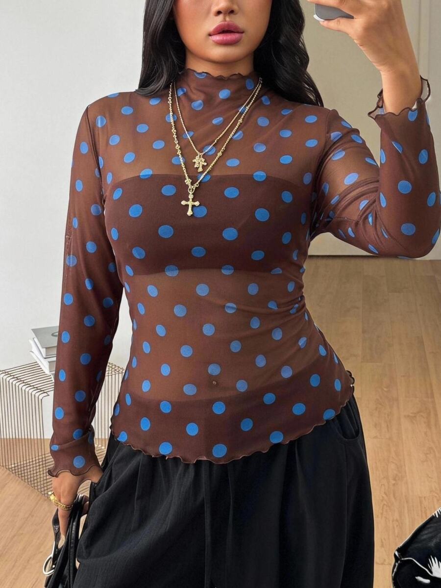 Women's brown sheer mesh long sleeve top featuring a polka dot print, stand collar, and lettuce trim details.