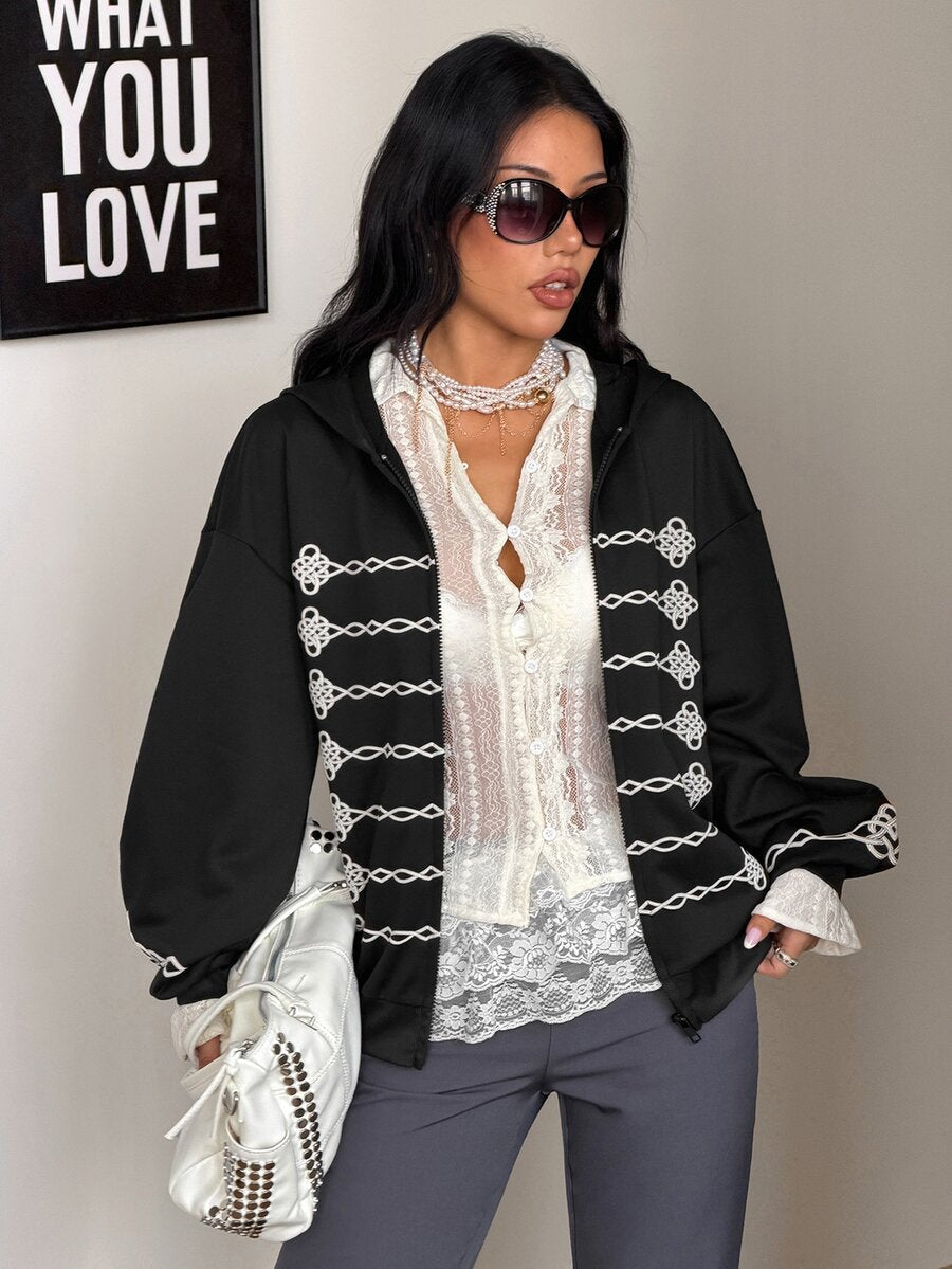 Women's army green camo zip up hoodie with drop shoulder sleeves, front pockets, and drawstring hood