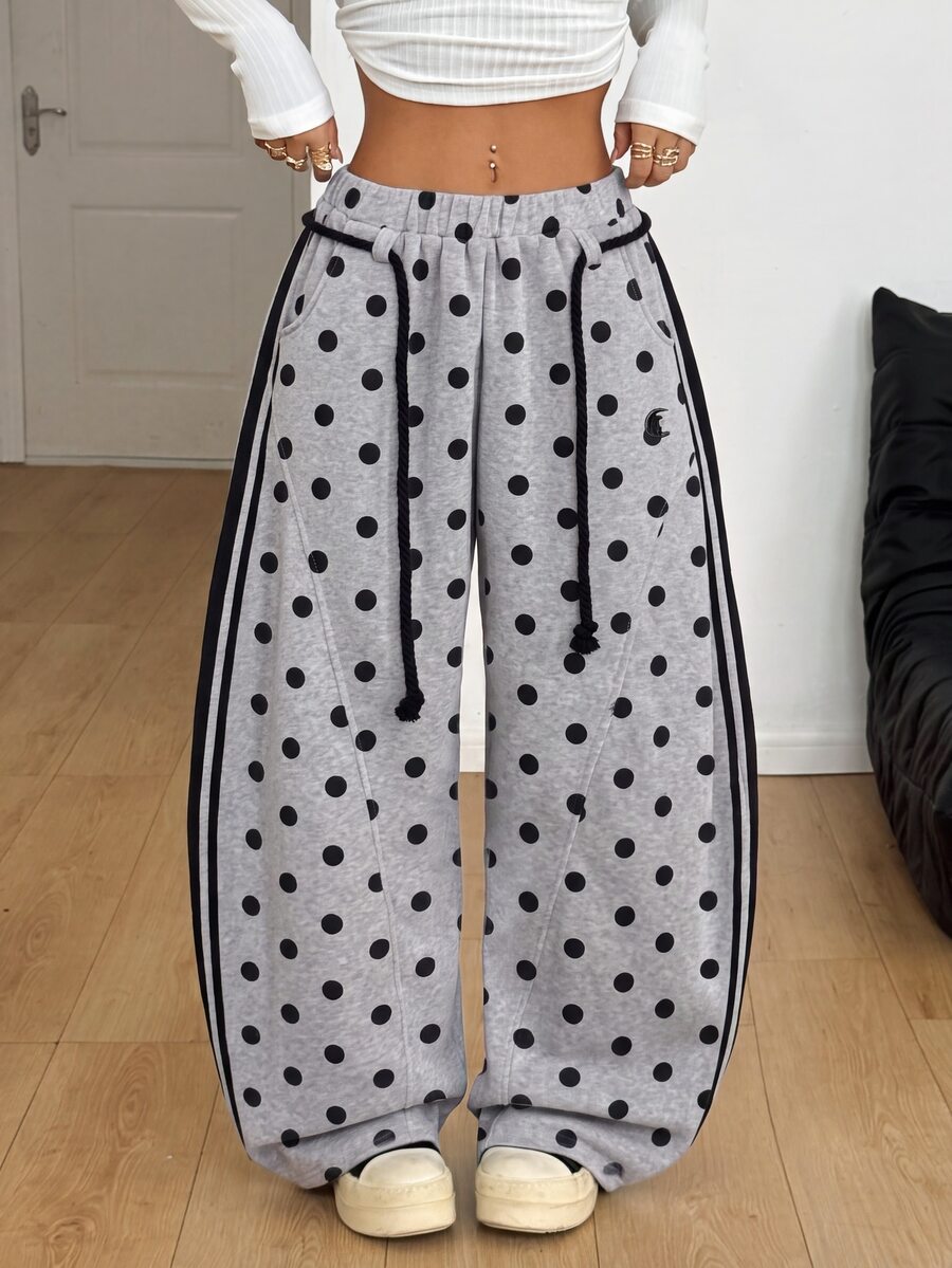 Women's casual grey plaid sweatpants featuring an elastic drawstring waistband, side pockets, and a relaxed loose fit.