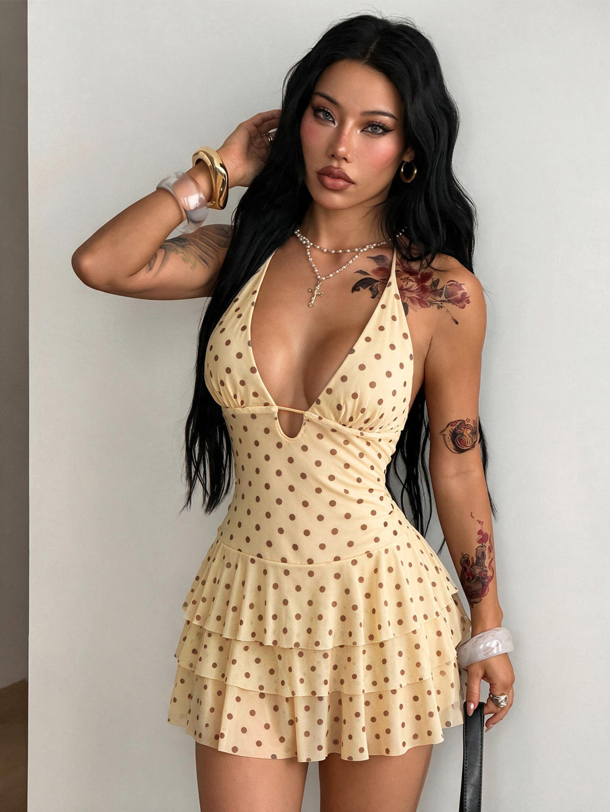 Front view of a women's lace halter mini dress featuring a slim-fit bodice, flared hem, and sleeveless design.