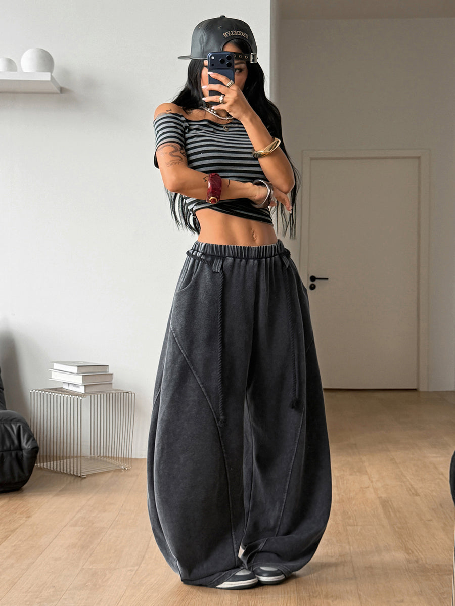 Women's casual grey plaid sweatpants featuring an elastic drawstring waistband, side pockets, and a relaxed loose fit.