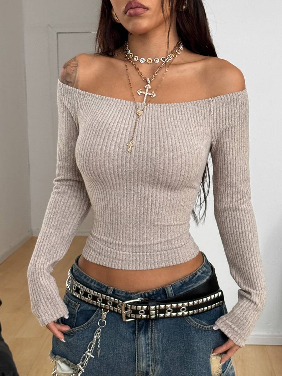 Women's striped off the shoulder long-sleeve top with contrast lace trim and ribbed knit texture.