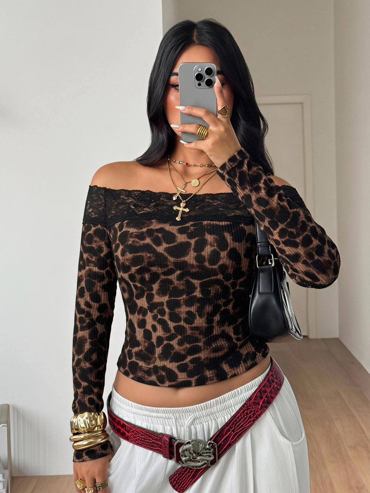 Women's striped off the shoulder long-sleeve top with contrast lace trim and ribbed knit texture.