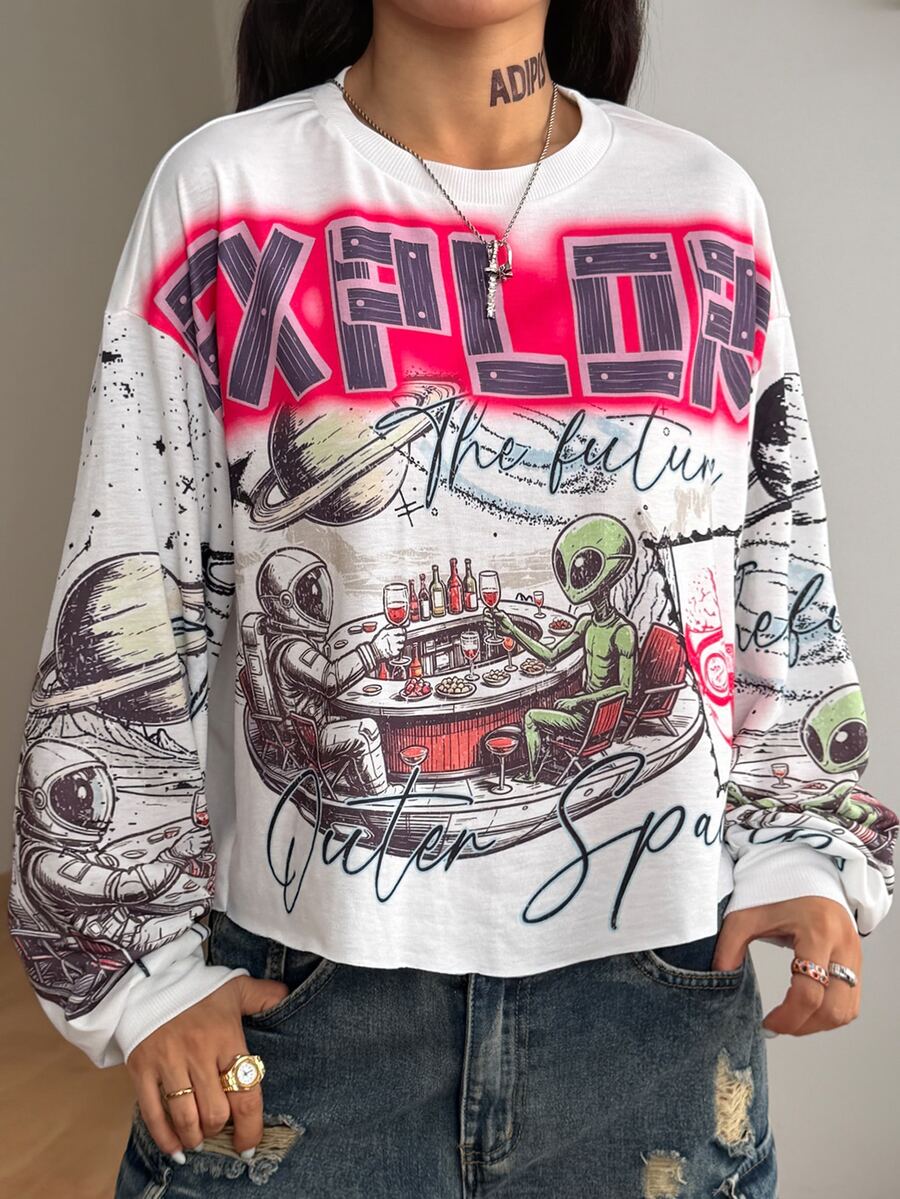 Women's white oversized long sleeve graphic T-shirt with drop shoulders and a round neckline.