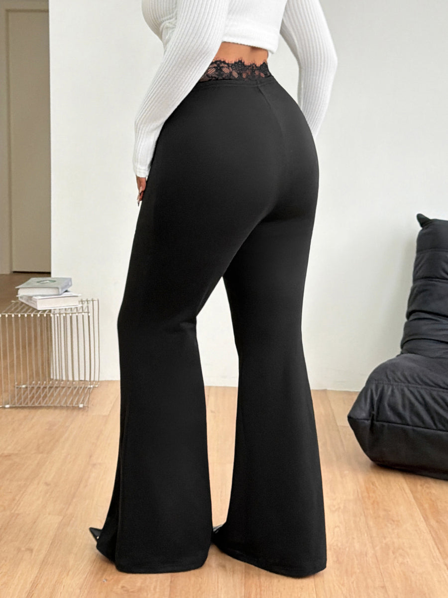 Women's plus size black flare leg pants with high elastic waist in stretchy knit fabric