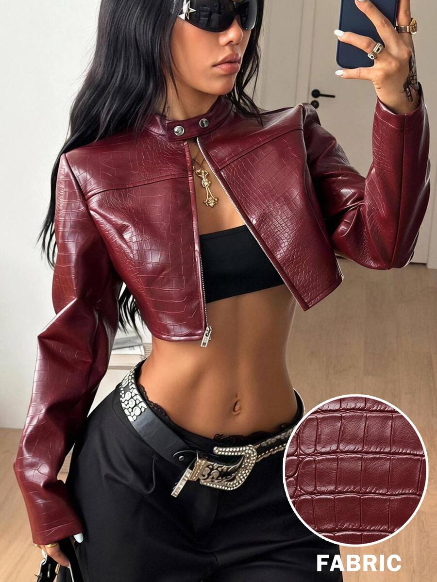 Women's metallic grey cropped faux leather jacket featuring a stand collar and asymmetrical zip front closure.