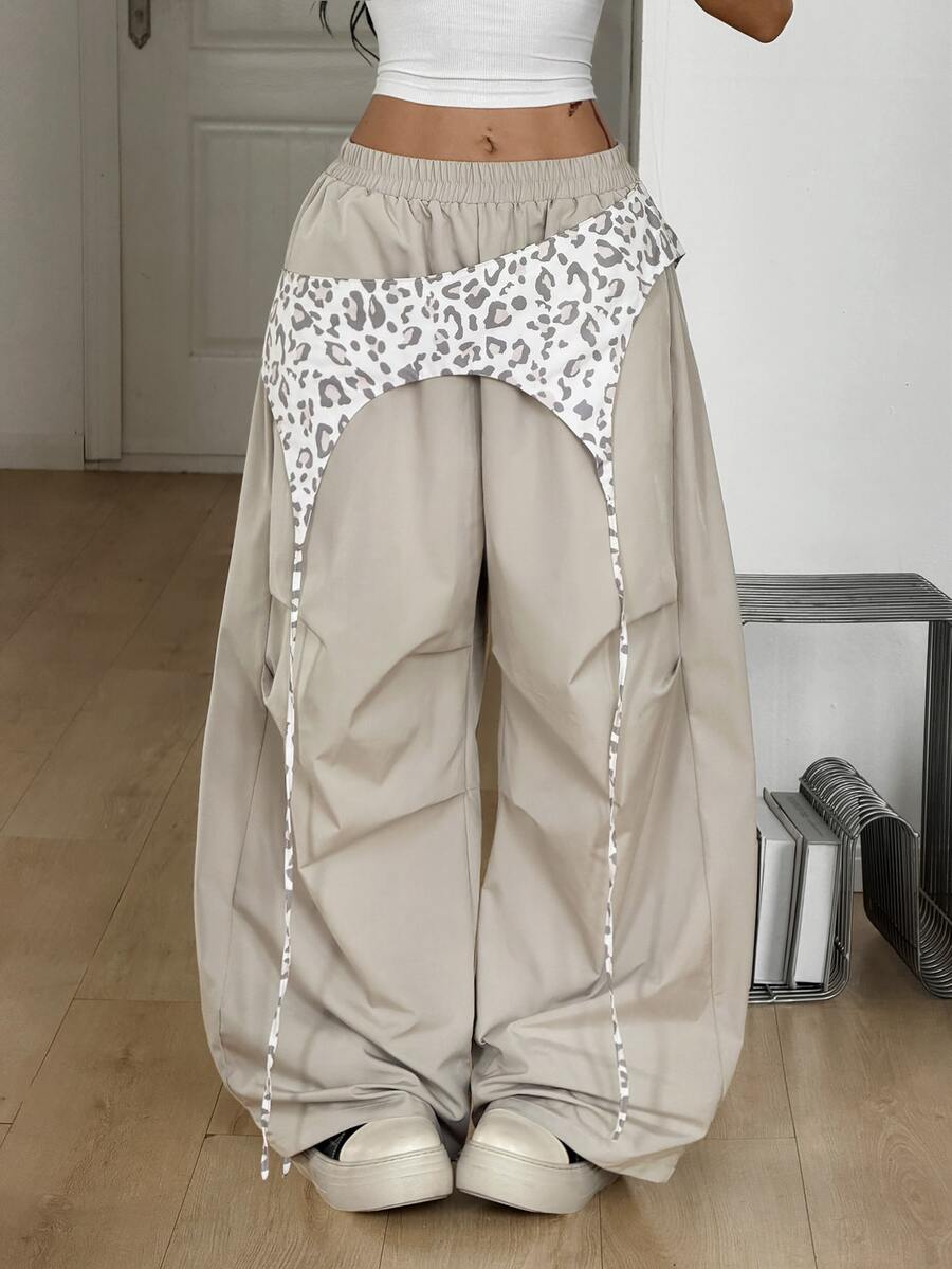 Women's casual wide leg long pants featuring an elastic drawstring waistband and loose fit silhouette.