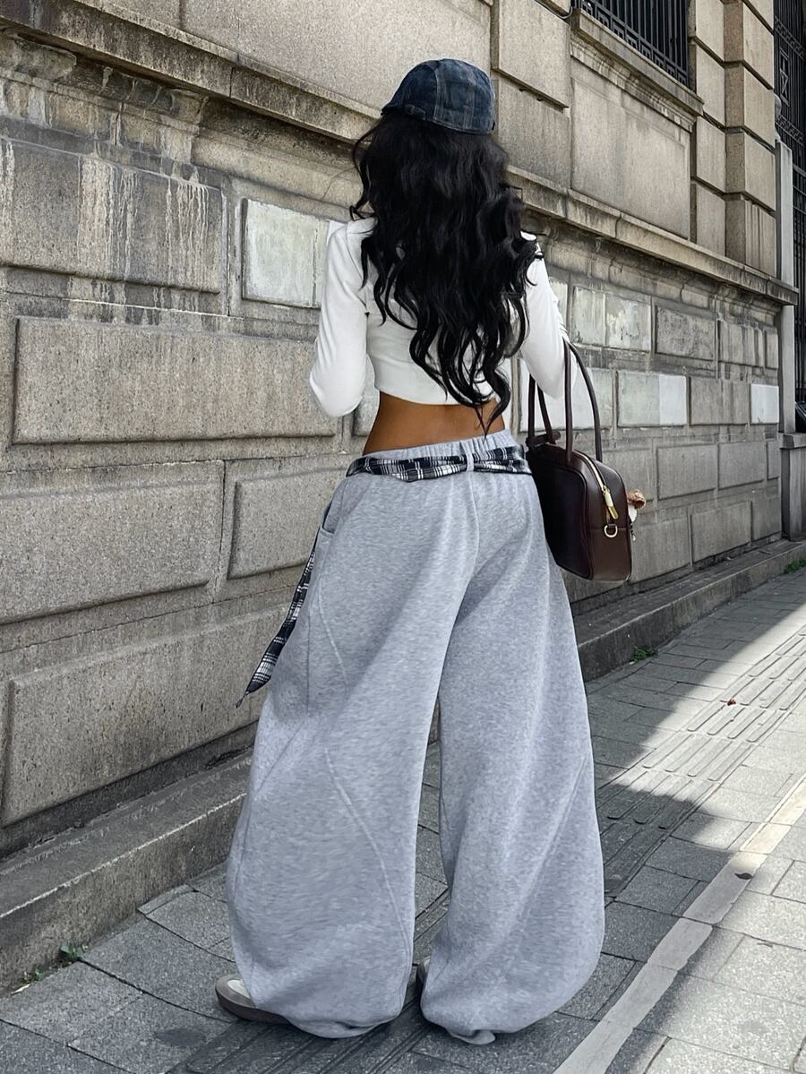 Women's casual grey plaid sweatpants featuring an elastic drawstring waistband, side pockets, and a relaxed loose fit.
