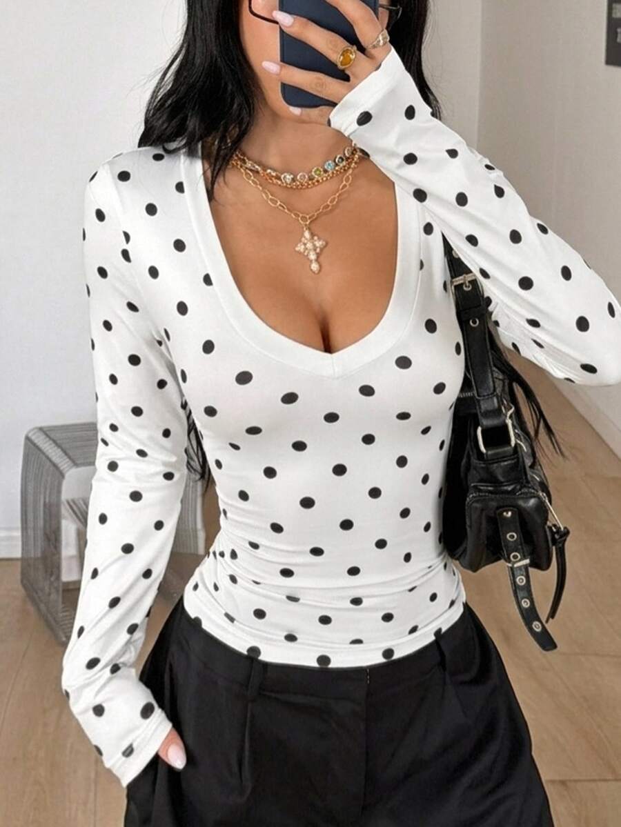 Women's fitted long sleeve rib-knit top featuring a deep V-neckline with delicate contrast lace detailing.
