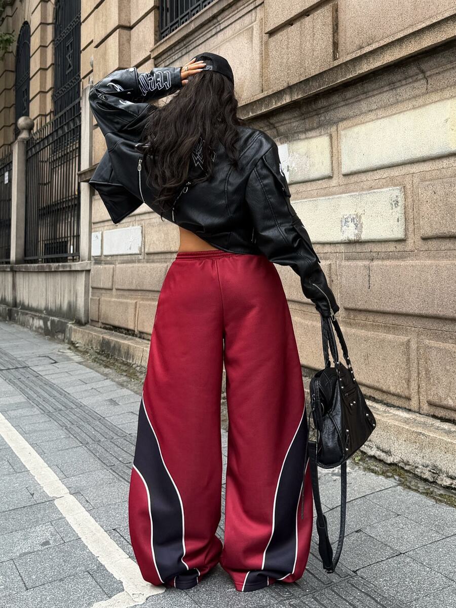 Women's loose fit wide leg graphic sweatpants in light grey with an elastic drawstring waistband