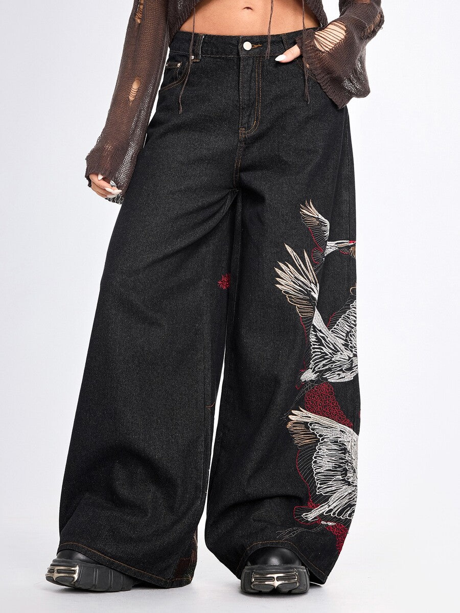 Women's black loose wide leg jeans with detailed crane and landscape embroidery, zipper fly, and ultra low waist.
