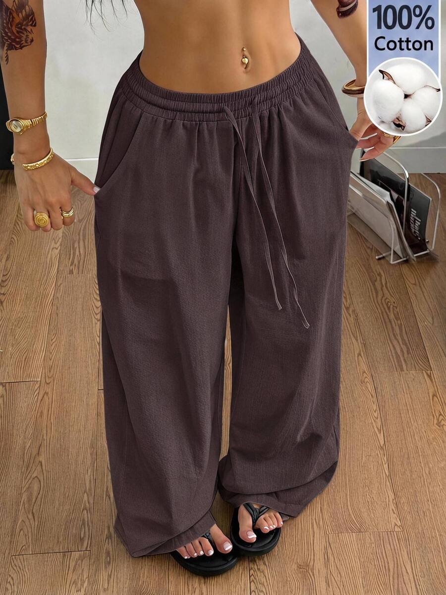 Plus size women's striped loose straight leg cropped pants with pleated detailing and side pockets