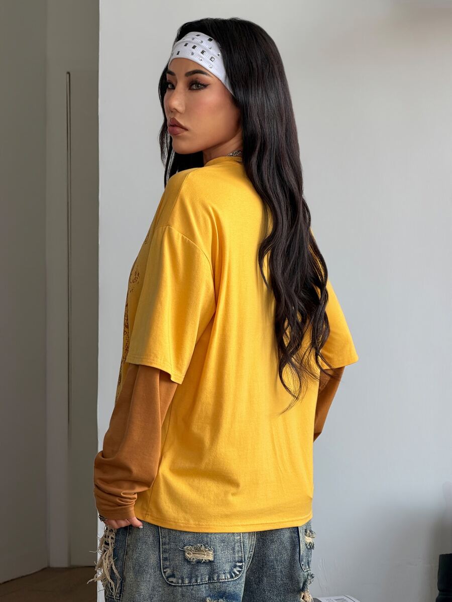 Women's casual graphic long sleeve t-shirt with a round neck, drop shoulder sleeves, and loose relaxed fit.