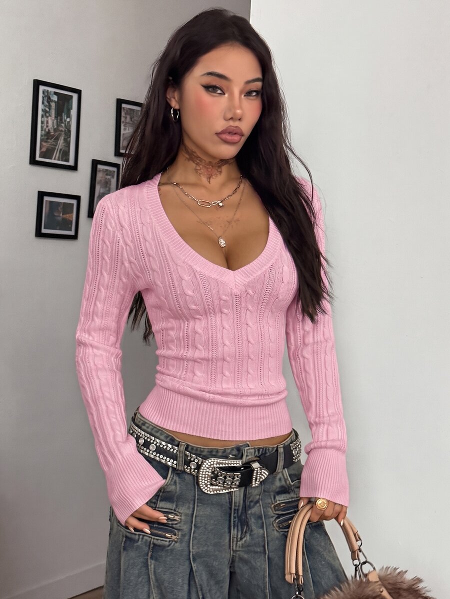 Women's slim fit cable-knit long sleeve sweater featuring a V-neckline and ribbed knit details.