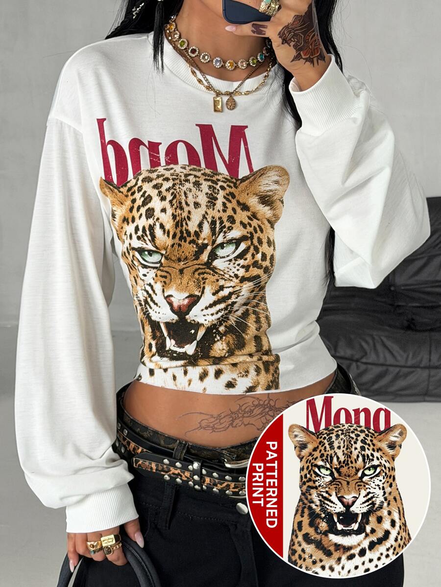 Women's white oversized long sleeve graphic T-shirt with drop shoulders and a round neckline.