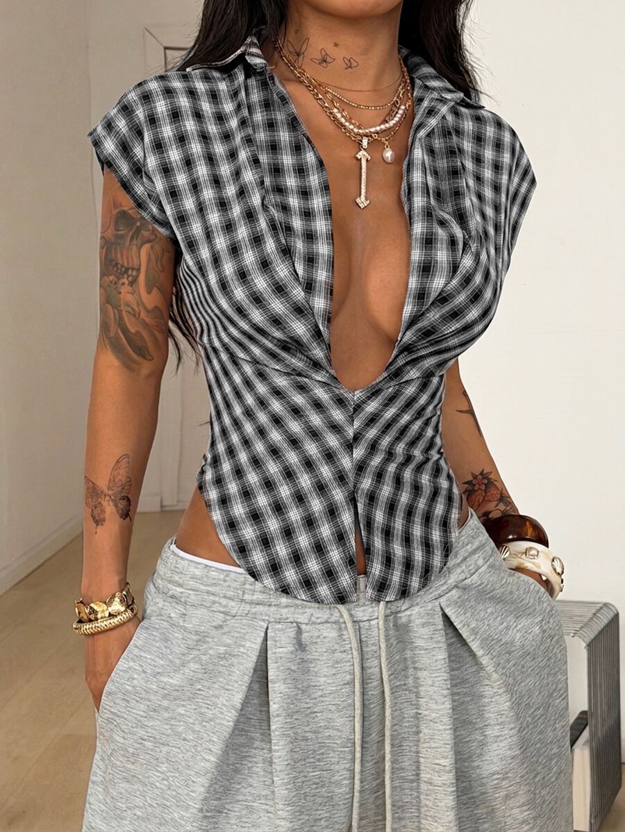 Women's plaid short sleeve shirt featuring a lapel collar and backless design in woven fabric.