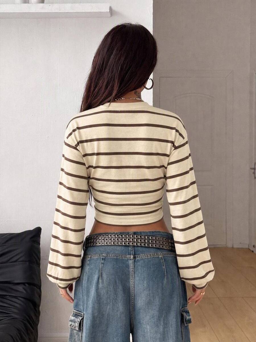 Women's brown waist-cinching sweatshirt featuring a round neck, drop shoulder long sleeves, and rib-knit cuffs.