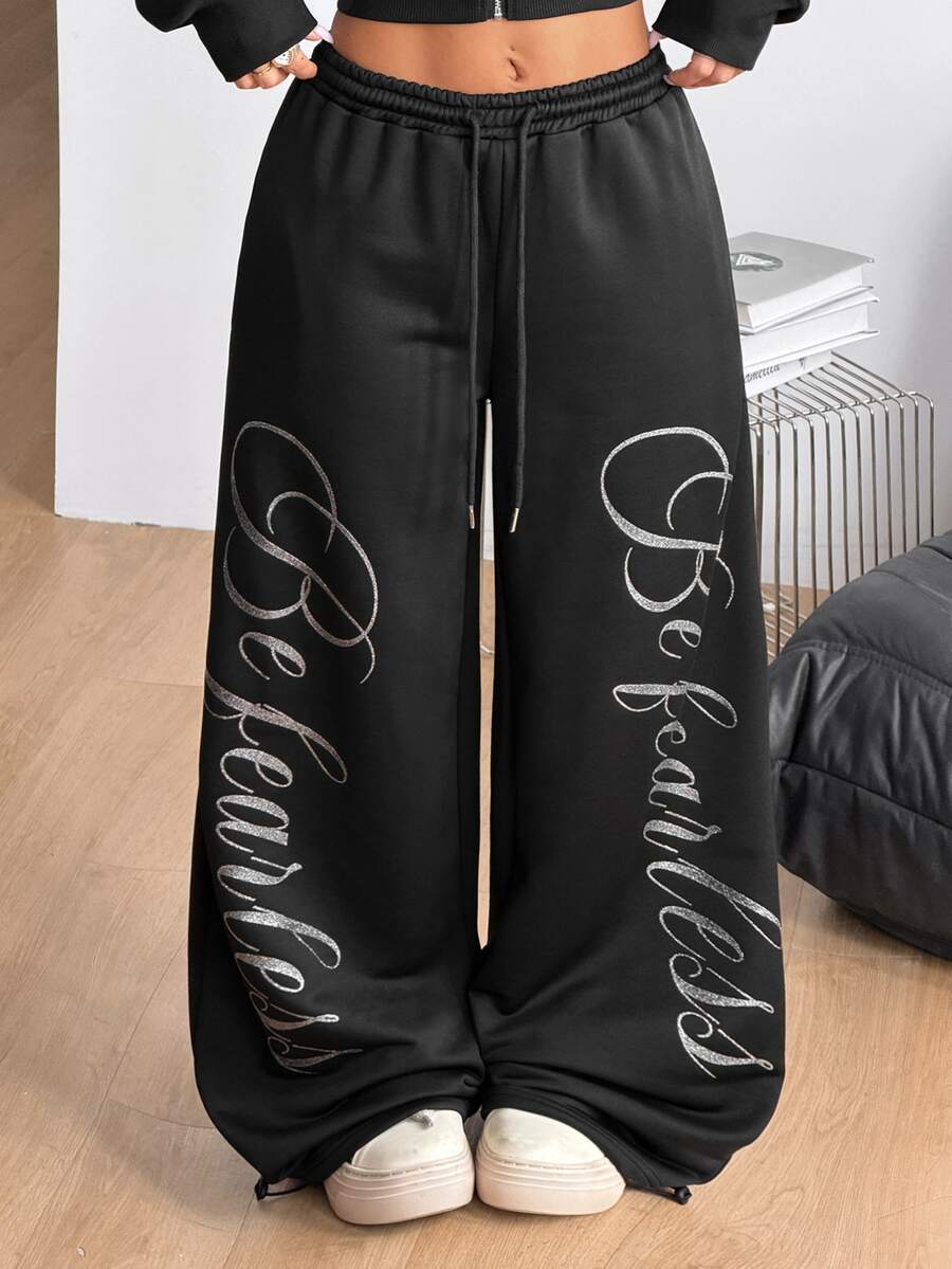 Women's wide leg trousers with a tree branch graphic pattern, loose fit, and mid-rise waist in woven fabric.