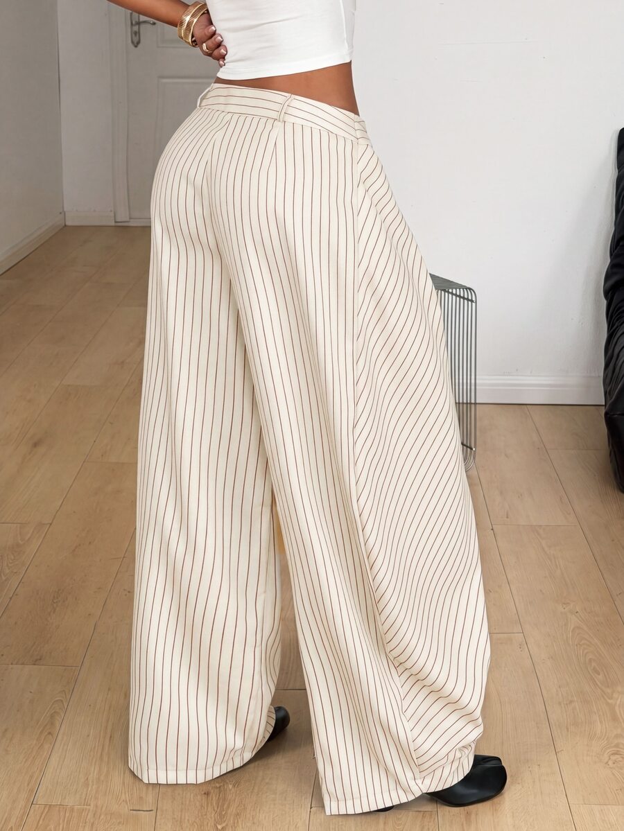 Women's loose fit pleated wide leg pants in royal blue pinstripe woven fabric with zipper fly closure.