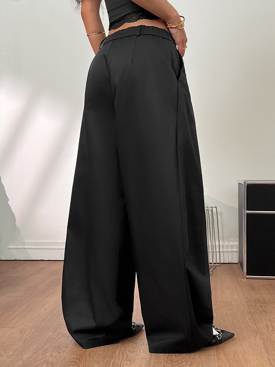 Casual black striped woven long pants for women featuring a low waist and loose fit design.