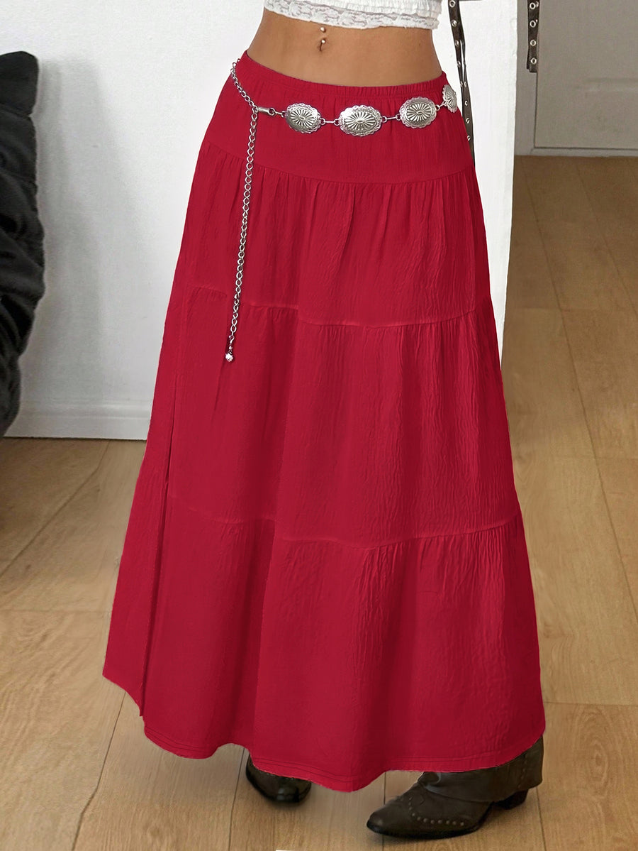 Women's red plaid long skirt featuring a low-rise waist and a side slit in lightweight woven fabric.