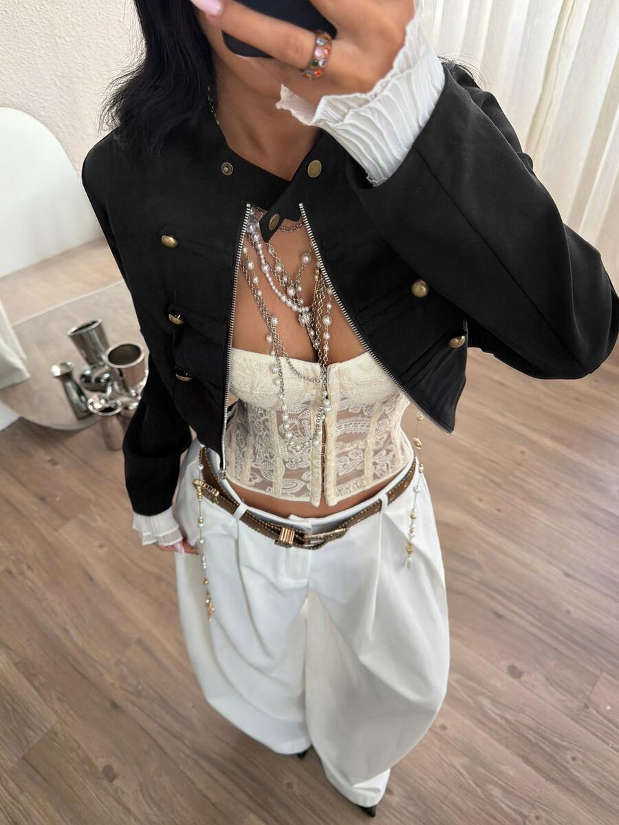 Women's metallic grey cropped faux leather jacket featuring a stand collar and asymmetrical zip front closure.
