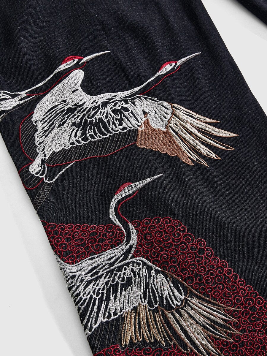 Women's black loose wide leg jeans with detailed crane and landscape embroidery, zipper fly, and ultra low waist.