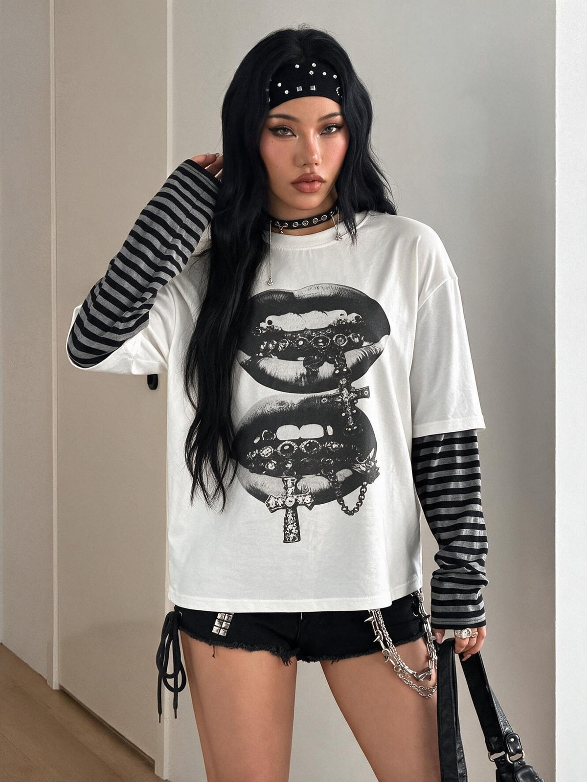 Women's casual graphic long sleeve t-shirt with a round neck, drop shoulder sleeves, and loose relaxed fit.