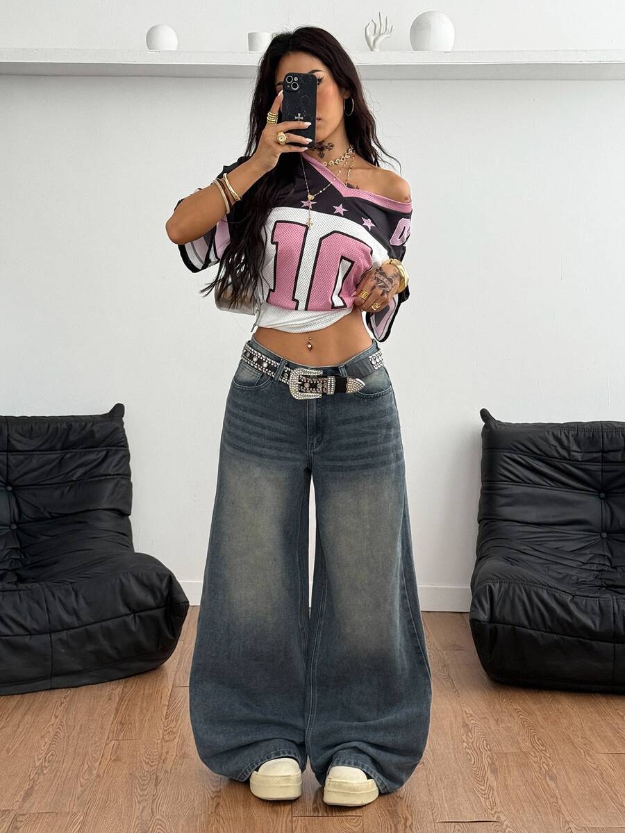 Loose wide leg denim jeans for women featuring a low waist, functional pockets, zipper fly closure, and extra long relaxed fit.