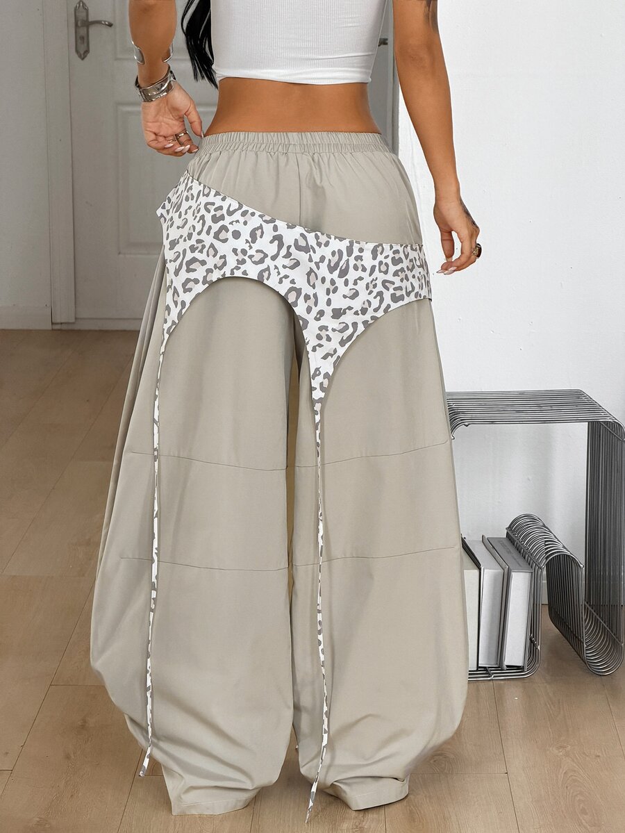 Women's casual wide leg long pants featuring an elastic drawstring waistband and loose fit silhouette.