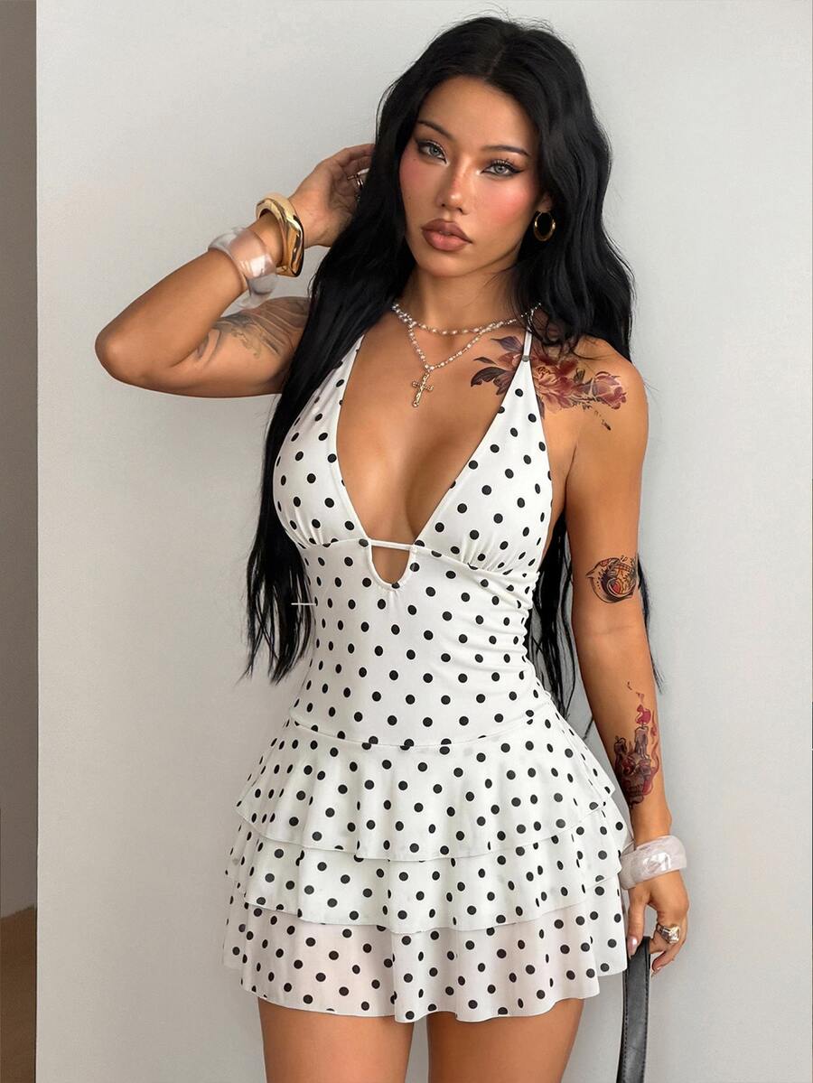 Front view of a women's lace halter mini dress featuring a slim-fit bodice, flared hem, and sleeveless design.